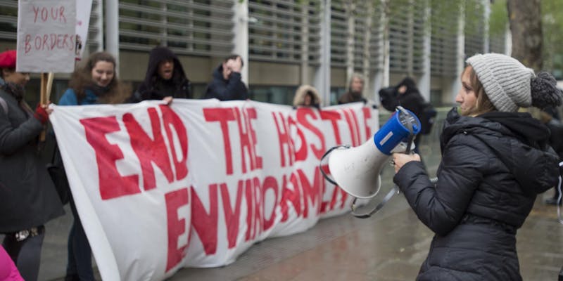 Banner: 'END THE HOSTILE ENVIRONMENT'