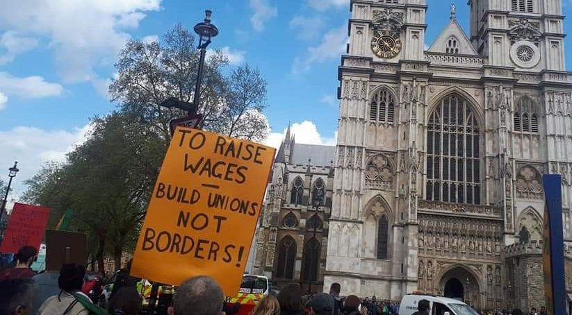 Protest in Parliament Sqaure. Placard reads "To raise wages - build unions not borders"